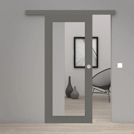 Gray sliding glass door installed in a modern gray interior doorway, with a light wood floor and a black wire chair visible in the room behind it.