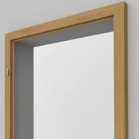 A light oak wood door frame with a white panel insert, shown against a neutral gray background.