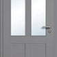 Gray door with glass panels and a handle