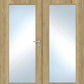 Double wooden doors with frosted rectangular glass panels and a silver metal handle on the left door.