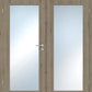 Double door interior door with light oak wood grain finish and two large frosted glass panels, featuring a silver metal lever handle and lockset.