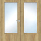 A pair of light oak double doors with large rectangular frosted glass panels and a silver metal handle on the left door.