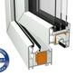 Cross-section view of a white and silver aluminum window frame profile with a glass pane, showing the inner structure and a blue circular Veka quality badge on the bottom left.