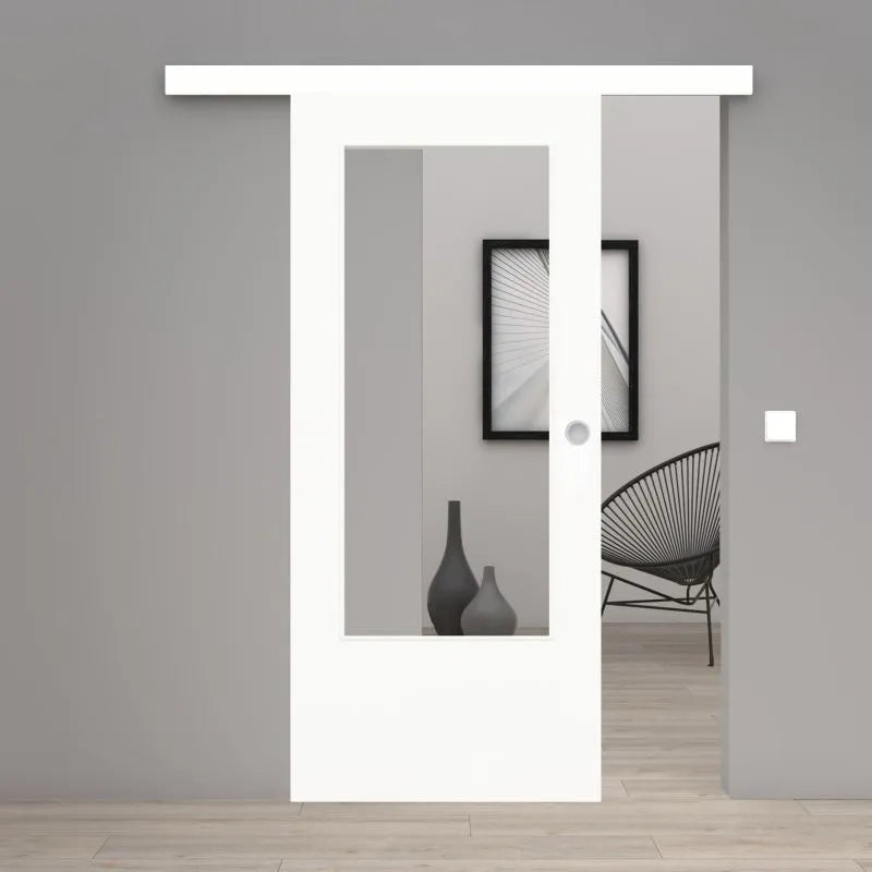 A modern white sliding glass door with a white header and bottom frame, shown in an open position revealing a minimalist gray interior with a black wire chair and framed wall art.