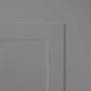 A close-up of a light gray paneled surface, showing a recessed rectangular panel corner.