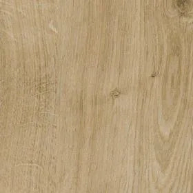 Close-up of a wooden surface with a light brown color and visible grain pattern.