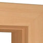 Close-up of a light natural wood frame corner showing the grain and beveled inner edge against a white background.