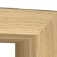 Close-up of a light oak wood picture frame corner showing the natural wood grain texture against a white background.