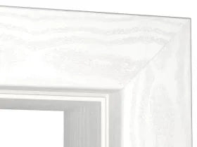 Close-up of a white picture frame corner with a subtle textured pattern, showing the inner bevel and depth.