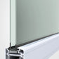 Close-up of a frosted glass panel installed in a white aluminum window or curtain rail profile, showing the seal and gasket details against a light gray background.