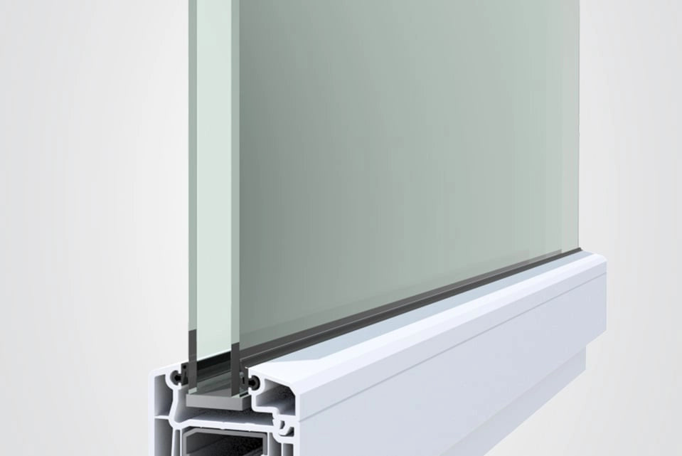 Close-up of a frosted glass panel installed in a white aluminum window or curtain rail profile, showing the seal and gasket details against a light gray background.