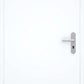 A modern white interior door with a minimalist silver metal lever handle and keyhole, shown against a matching white background.