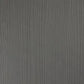 A close-up of a dark gray woodgrain texture with vertical grain lines.