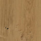 A close-up of a light brown wood grain surface with visible knots and natural texture.