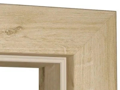 Close-up of a light natural wood picture frame corner showing the grain texture and beveled inner edge against a white background.